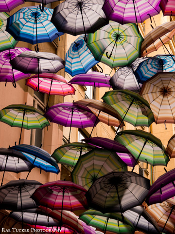 Striped and colorful hanging umbrellas provide a canopy in Bucharest, Romania
