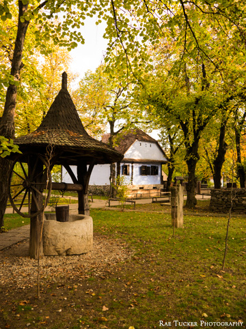 A wooden and stone well in Bucharest's Village Museum in Romania.
