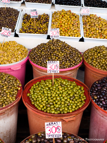 Barrels of green and black olives at a market in Tirana, Albania