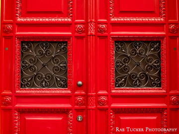 A bright red set of doors in Prague, Czechia