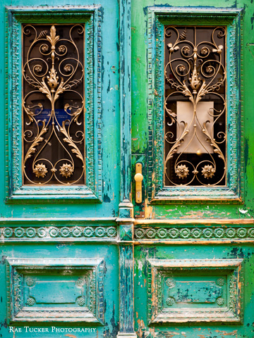Green and turquoise doors in Prague, Czechia.