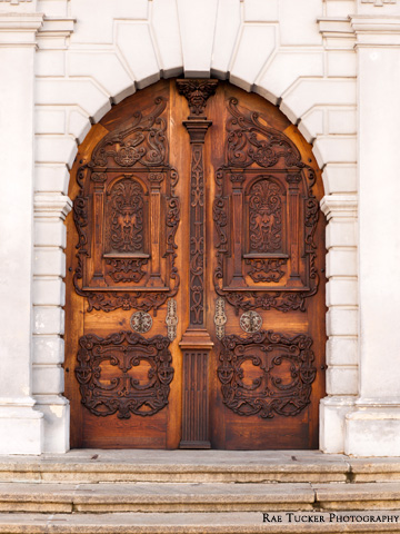 In intricately carved wooden door in Bratislava, Slovakia