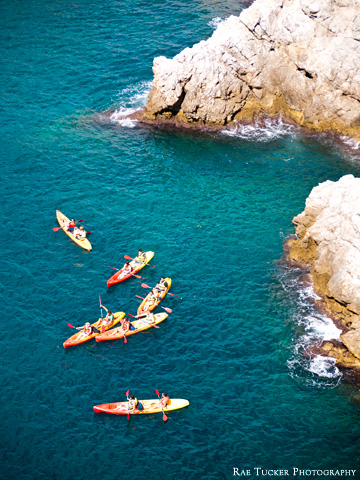 Colorful kayaks in the blue waters of the Adriatic Sea