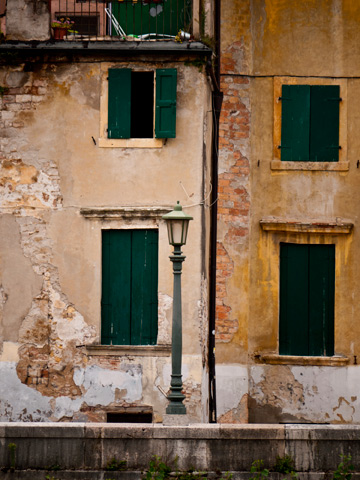 A streetlamp and windows in Verona, Italy.