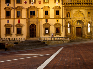 Buildings illuminted at night in Arezzo's Piazza Grande