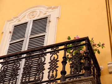 A wrought iron balcony in Parma, Italy