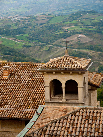 A view of terra cotta rooftops and country side in San Marino