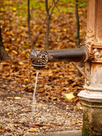 A running water fountain during the autumn in Parma, Italy.