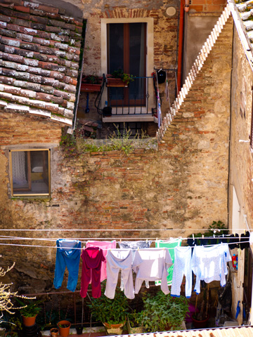 Laundry dries under the afternoon sun in Montepulciano, Italy