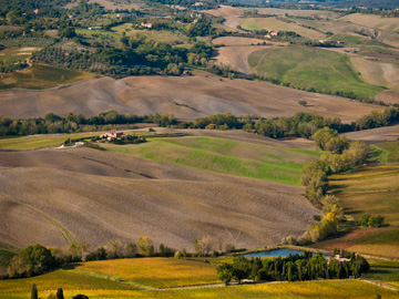 Farmland scattered over Tuscan hills.