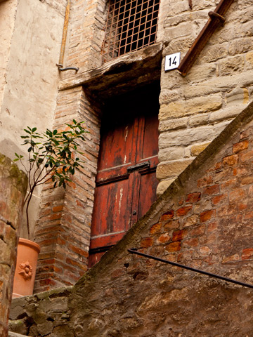 Stone architectural details on a house in Italy.