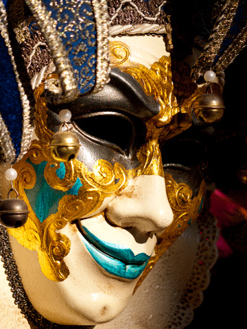 A venetian mask hangs in Venice, Italy