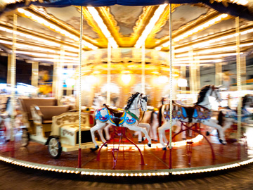 A children's carousel set up for a Christmas Market in Rome, Italy