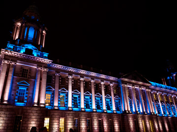 The city hall of Belfast illuminated on a winter's night.