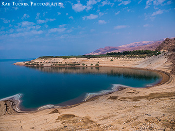 On a beautiful autumn day, the Dead Sea sinks below the mountains of Jordan.